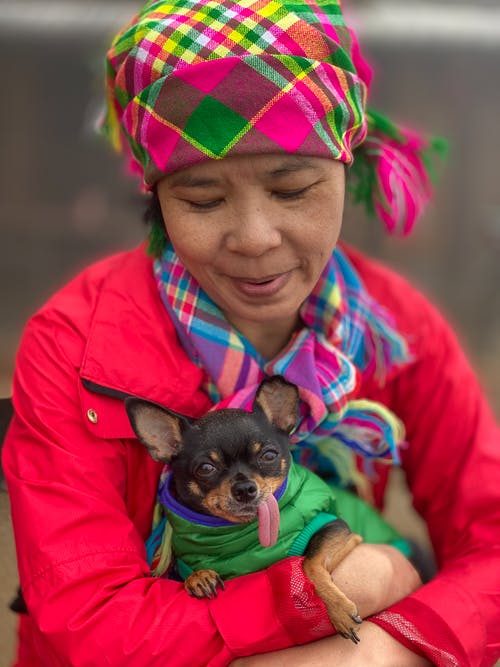 woman holding her chihuahua